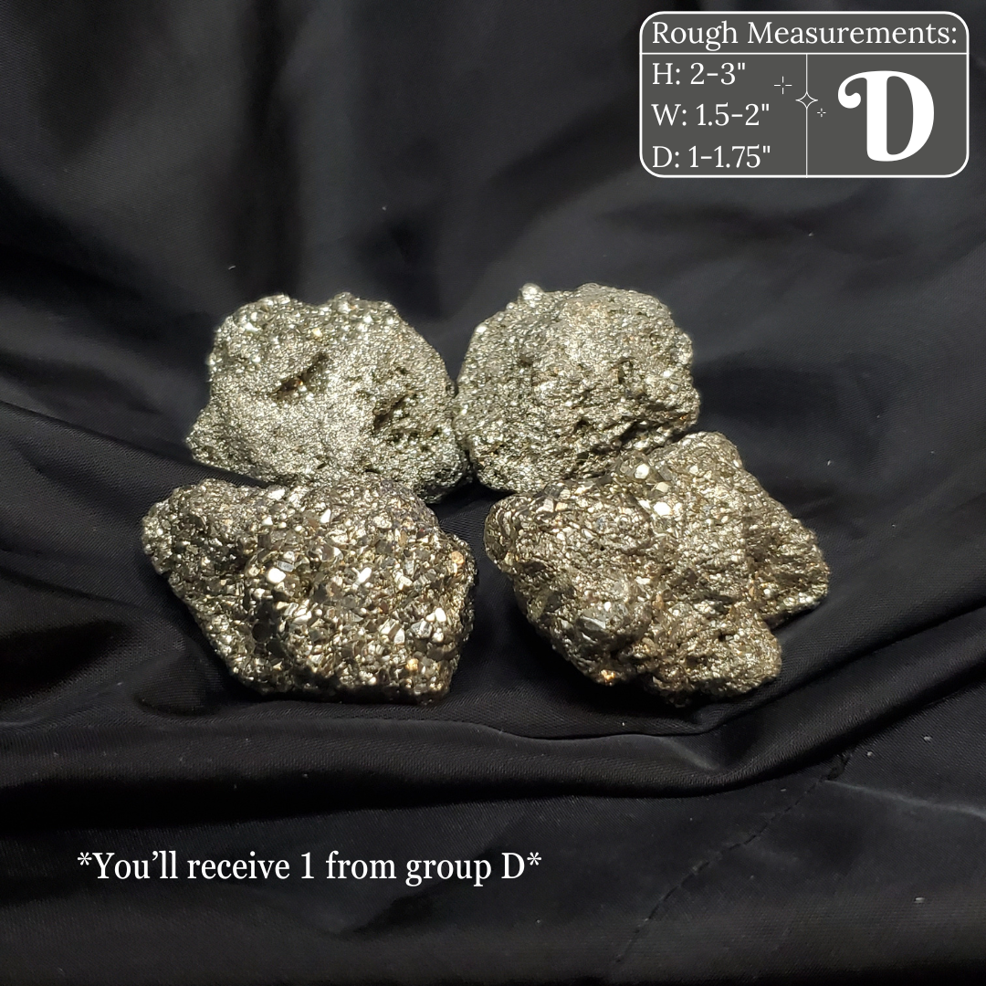 Four metallic pyrite crystals on a black fabric background with measurements and text overlay.