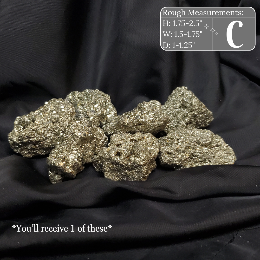 Pile of metallic rocks on a black background with measurements displayed.